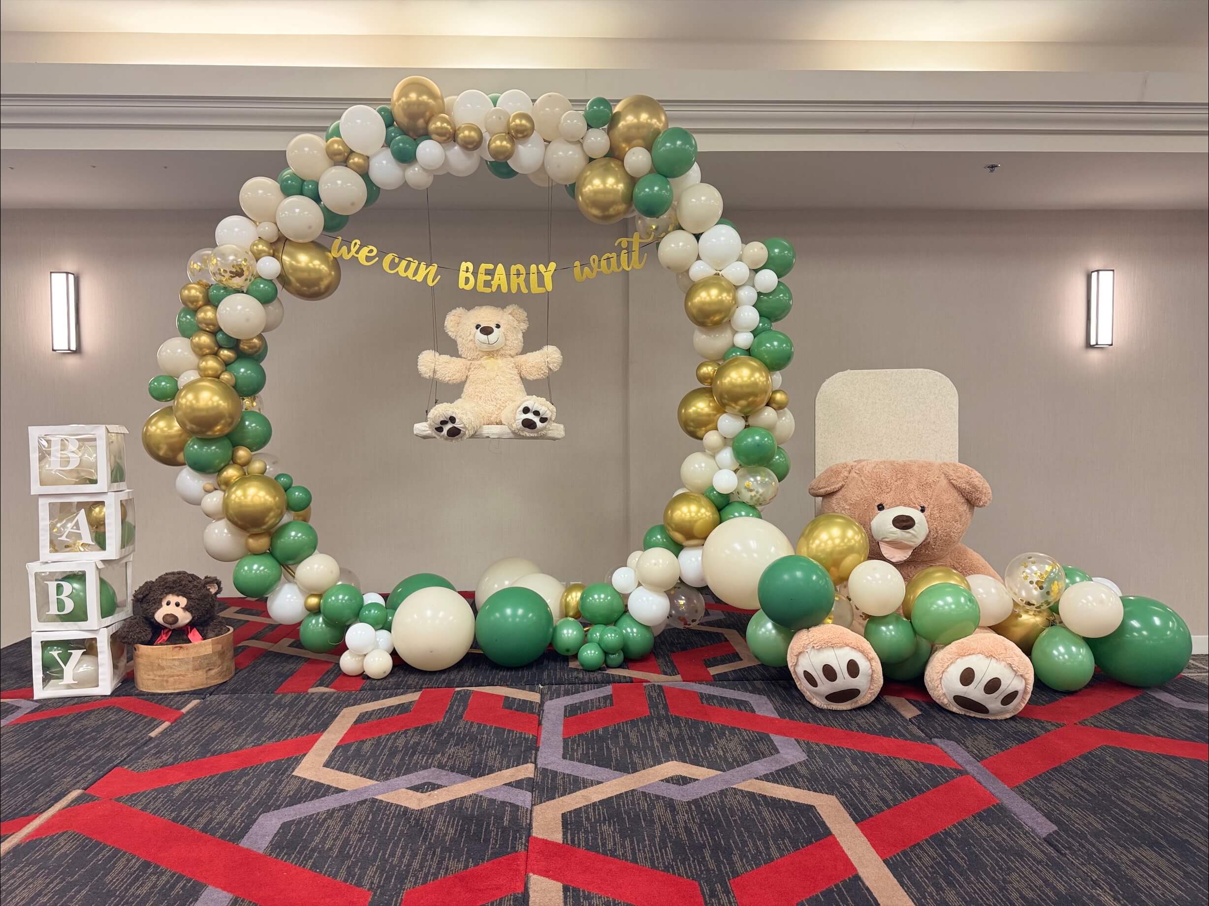 Birthday party decor with gold and black table settings and streamers
