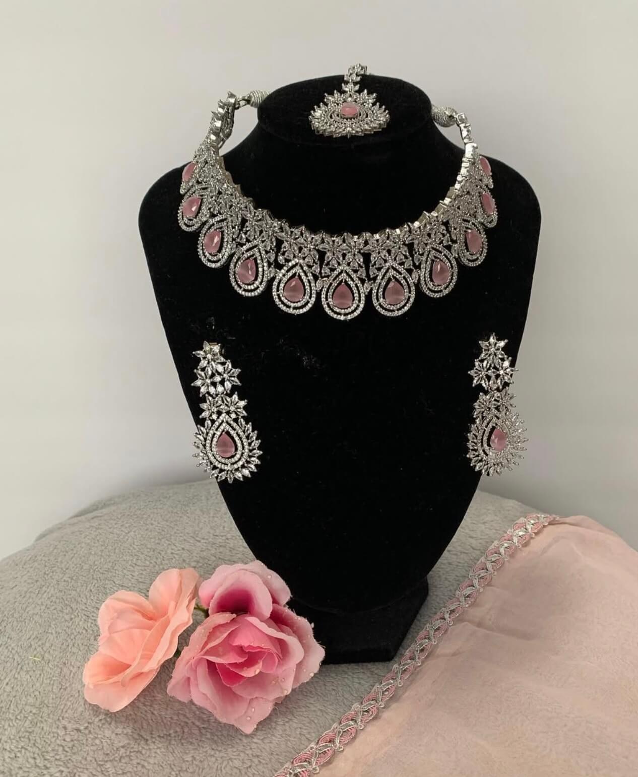 Gold bridal necklace with intricate kundan work and dangling pearls for wedding styling