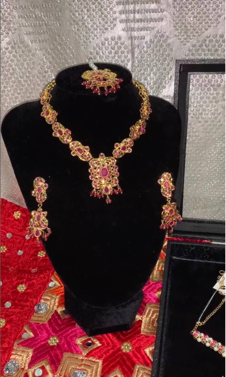Classic bridal jewellery ensemble in red and gold tones for Indian weddings