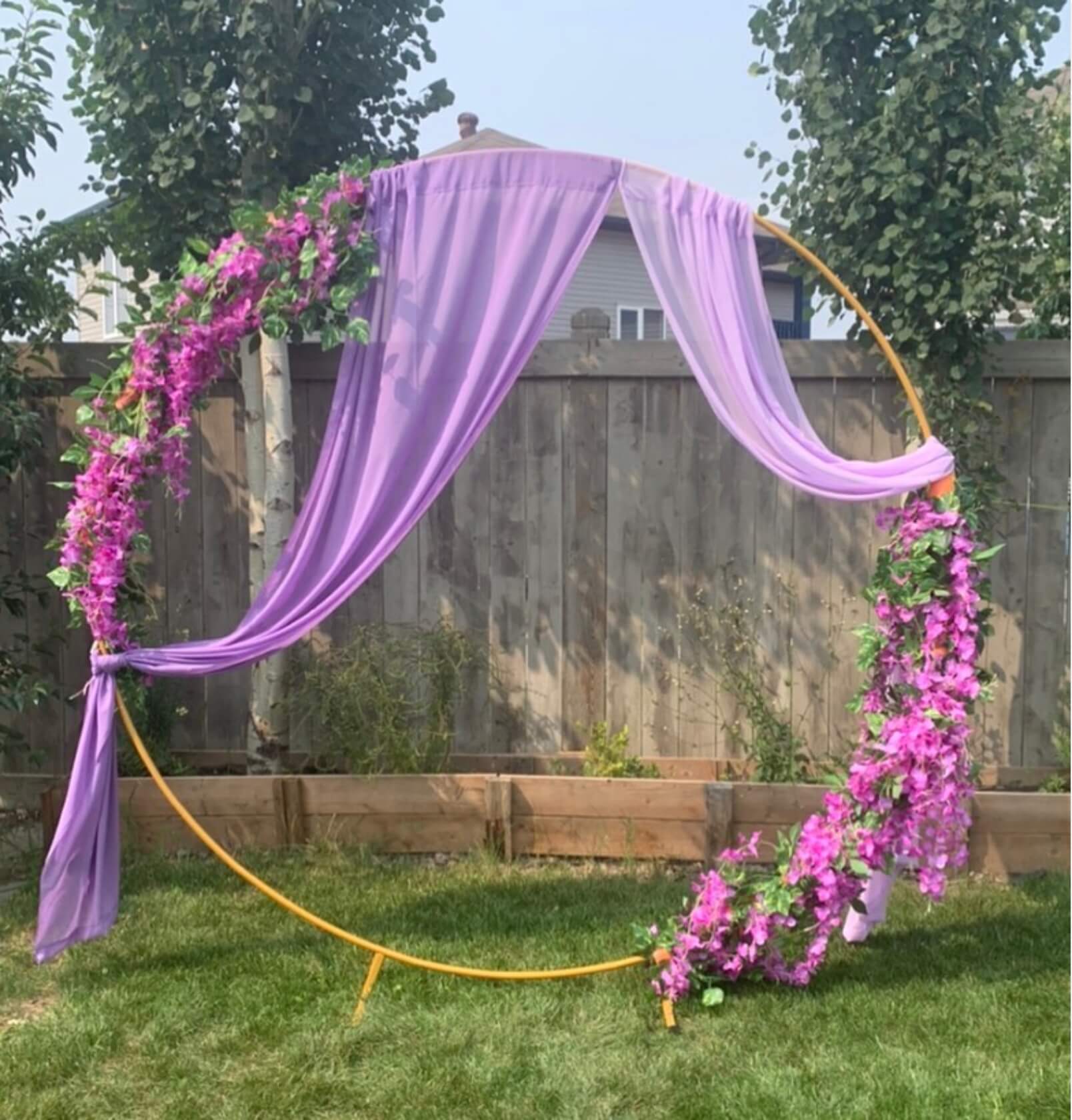 Traditional mandap arrangement with gold pillars and marigold garlands